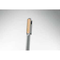 A pen in grey with a wooden touch on the clip. The design is sleek and modern.