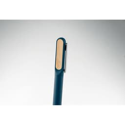 A pen with a teal body and a natural wood accent, featuring a metal clip.