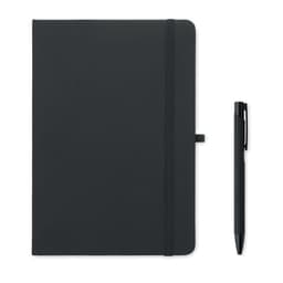 A black notebook with a pen beside it. The notebook has an elastic band and a ribbon bookmark.