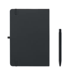 A black notebook with an elastic closure and a matching black pen placed beside it.