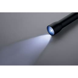 A black torch with a focused beam of light illuminating a surface. It has a cylindrical shape and a visible logo.