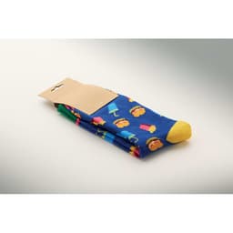 Colourful blue socks with a playful pattern and a yellow toe, packaged with a plain backing.