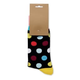 A pair of socks in black with colourful polka dots, featuring a cardboard label attached to the top.