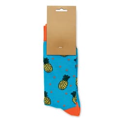 A pair of bright blue socks featuring pineapple patterns and orange accents, with a cardboard tag attached.