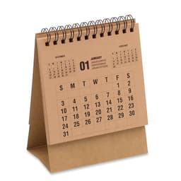 A desk calendar with a spiral binding, featuring a brown kraft cover and black printed dates for January and February.