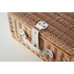 A wicker basket featuring a metallic latch, showcasing a natural woven texture in light brown tones.