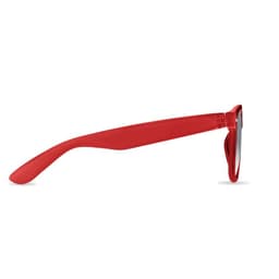 A pair of sunglasses with a vibrant red frame and dark lenses, featuring a logo on the side.