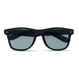 A pair of black sunglasses with grey lenses and a sleek design. Includes a logo on one arm.