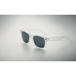 A pair of transparent sunglasses with dark lenses, featuring a simple design and clear frames.