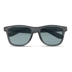 A pair of grey sunglasses with dark lenses and a sleek frame, featuring a logo on the side.
