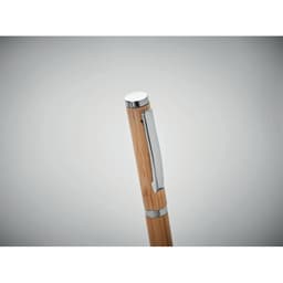 A sleek pen with a bamboo body and silver accents, featuring a clip and a polished cap.