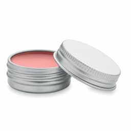 A small silver tin container with a pink balm inside, slightly open to reveal its contents.