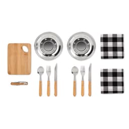 A set of stainless steel dog bowls, bamboo cutting board, napkins, and wooden-handled cutlery on a white background.