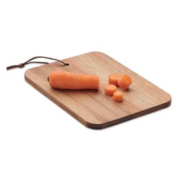 A wooden chopping board with a whole orange carrot and several sliced pieces of carrot on top.
