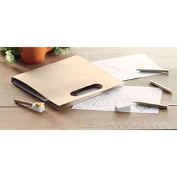 A kraft folder with an open handle, along with sheets of paper, pencils, and a eraser on a wooden surface.