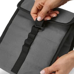 A grey cooler bag featuring a roll top, secured with a black strap and metal G hook. Contains a logo.