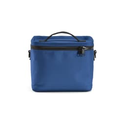 A blue cooler bag featuring thermo-injected zippers and a carrying handle, with a textured surface.