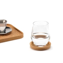 A round cork coaster with a rim, featuring a glass of water and a coffee cup on a matching tray.