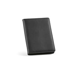 A black A5 folder with a zipper closure, featuring a notepad made from 64 FSC® sheets and a logo.