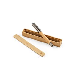 A bamboo pen with a silver clip, displayed in an open bamboo case with a matching bamboo sleeve.