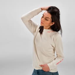 A cream-coloured women's crew neck sweatshirt made from organic cotton and rPET, with a small logo on the front.