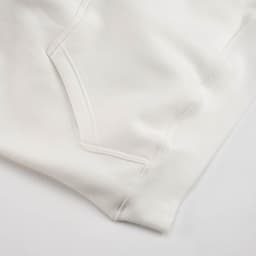 A white hooded sweatshirt featuring a front pocket and ribbed cuffs, made from organic cotton and recycled materials.
