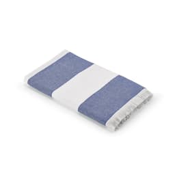 A folded towel featuring blue and white stripes, with a fringed edge. It has a logo on one corner.