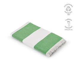 A green and white striped towel with a fringed edge, made from sustainable materials in Portugal.