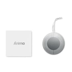 A round silver decorative item with a striped design, placed beside a white box featuring branding.