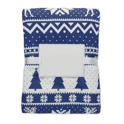 A blanket featuring a blue and white geometric design with trees and snowflakes, secured with a white strap.
