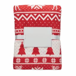 A red and white blanket featuring a festive pattern with trees and snowflakes, secured with a white band.