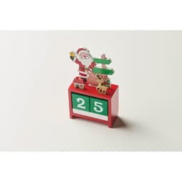 A decorative wooden countdown calendar in red, featuring a Santa, reindeer, and a tree with the date displayed as 25.
