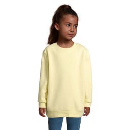 A yellow sweatshirt for kids, featuring a simple design and long sleeves, worn by a child.