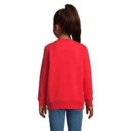 A red sweatshirt designed for kids, featuring a simple design and long sleeves. It has a logo on the back.