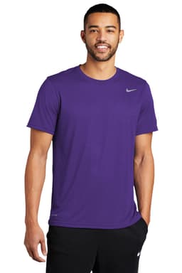 A purple Nike Team rLegend Tee with a simple design and a logo, modelled by a man.