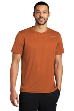 A rust-coloured Nike Team rLegend Tee with a crew neckline and short sleeves, featuring a logo.