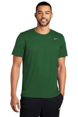 A man wearing a green Nike Team rLegend Tee, standing against a white background, featuring a logo on the chest.