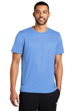 A blue t-shirt featuring a logo, worn by a man with a relaxed posture.