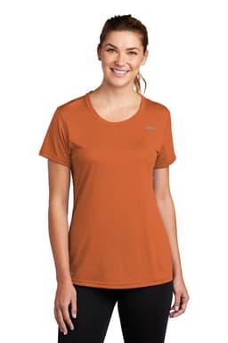 An orange Nike ladies' t-shirt with short sleeves and a round neckline, featuring a logo.