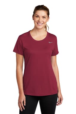 A maroon Nike ladies' T-shirt with short sleeves and a logo on the chest.