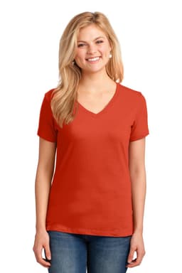 A woman smiles while wearing a red V-neck cotton T-shirt. The shirt has short sleeves and a fitted design.