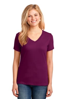 A woman models a purple Port & Company Ladies Core Cotton V-Neck Tee, featuring short sleeves and a classic fit.