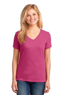 A woman is wearing a vibrant pink Port & Company Ladies Core Cotton V-Neck Tee. The shirt has a logo.