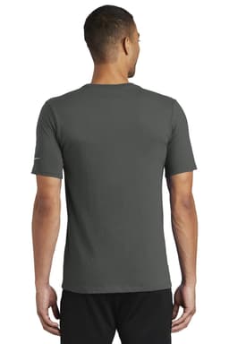 A man wearing a green Nike Dri-FIT cotton/polyester T-shirt, shown from the back. The shirt features a logo.