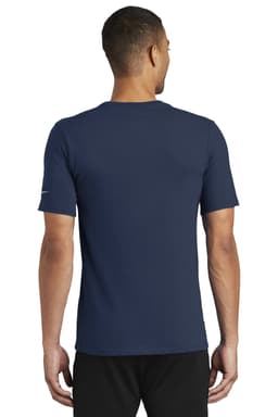 A navy blue Nike Dri-FIT T-shirt featuring a logo, shown from the back on a model.
