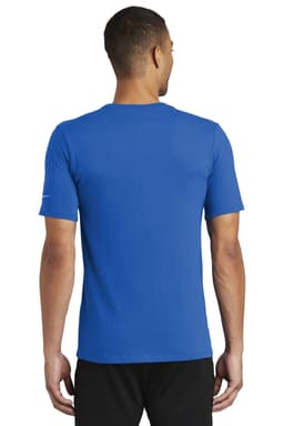 A blue Nike Dri-FIT Cotton/Poly Tee seen from the back, featuring a logo on the sleeve.