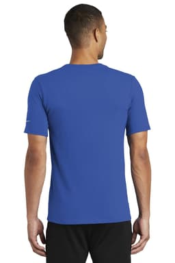 A blue Nike Dri-FIT Cotton/Poly Tee displayed on a model from the back, featuring a logo on the sleeve.