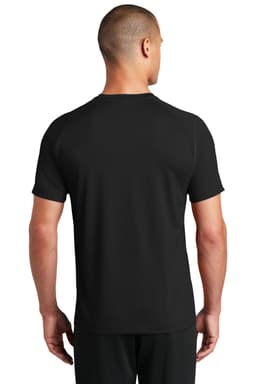 A man is wearing a black OGIO ENDURANCE Level Mesh Tee, viewed from the back. The shirt features a logo.