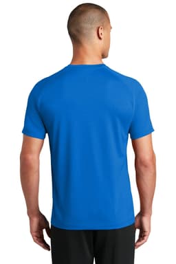 A blue mesh T-shirt featuring a logo, viewed from the back on a model.