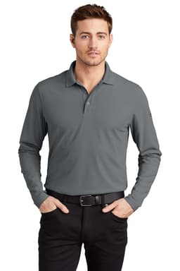 A long-sleeve, grey OGIO Caliber2.0 shirt with a collar and a logo, worn by a model with black trousers.